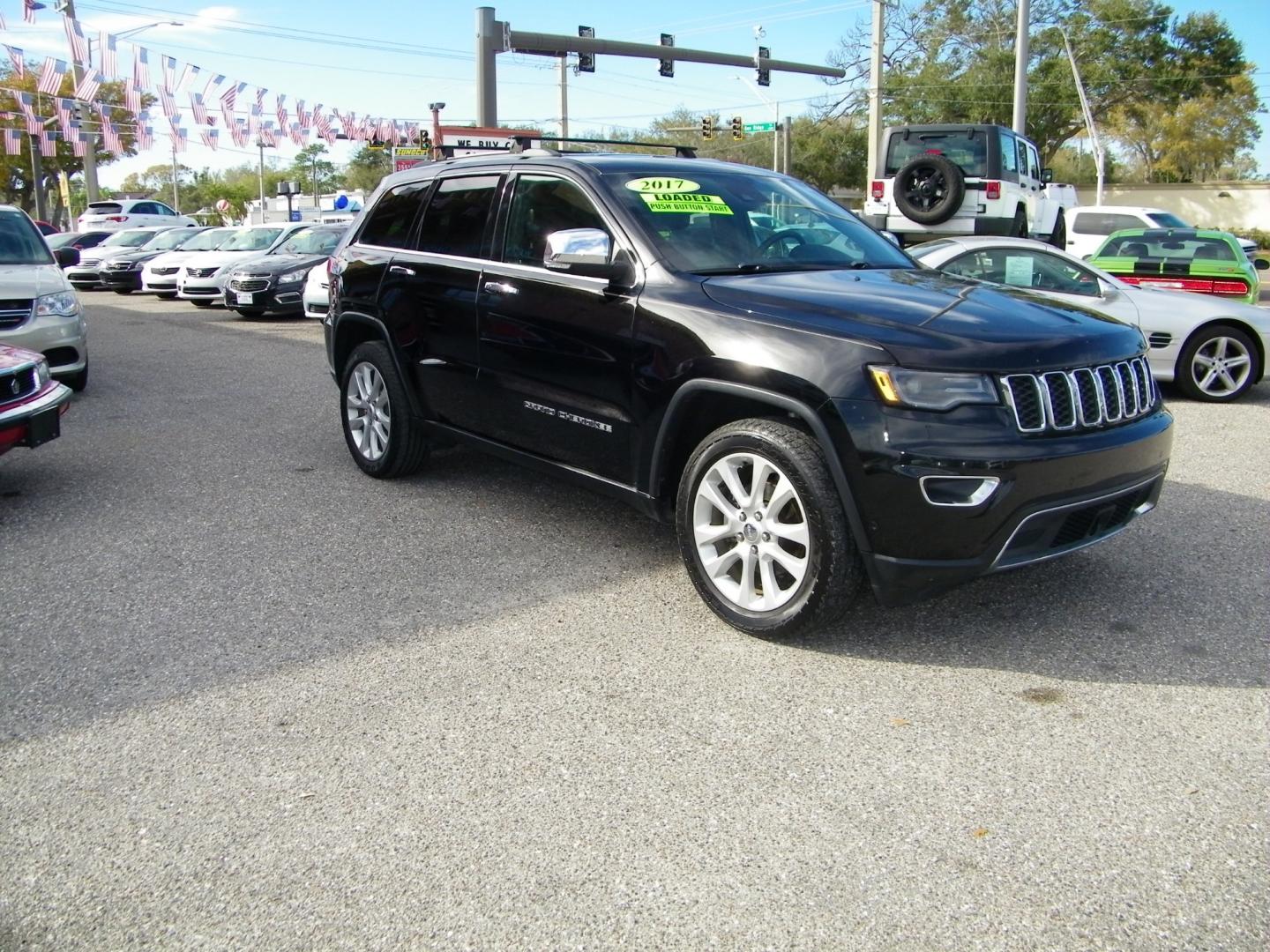 2017 Black /Black Jeep Grand Cherokee Limited (1C4RJEBG4HC) with an 3.6L V6 engine, Automatic transmission, located at 4000 Bee Ridge Road, Sarasota, FL, 34233, (941) 926-0300, 27.298664, -82.489151 - Photo#2